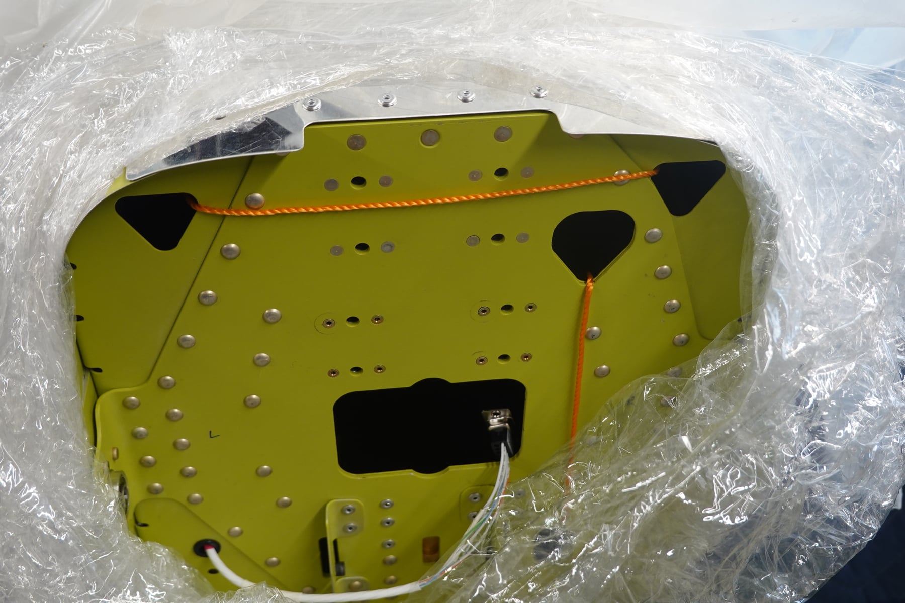 The whole fuselage bulkhead. The other rivets look good.