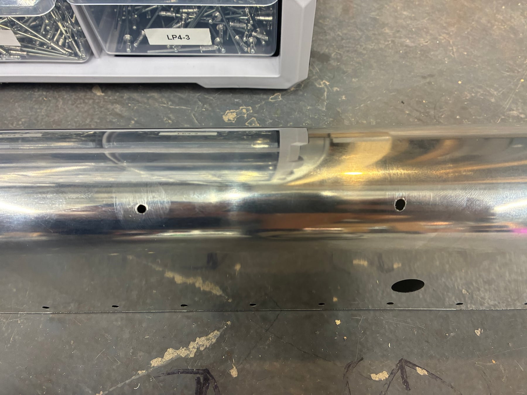 The flaperon leading edge. I'm not proud to show this, but if it helps somebody, that's awesome. See the hole on the right which was drilled straight with a #30 and the hole on the left which was a #40 before the #30 drill.