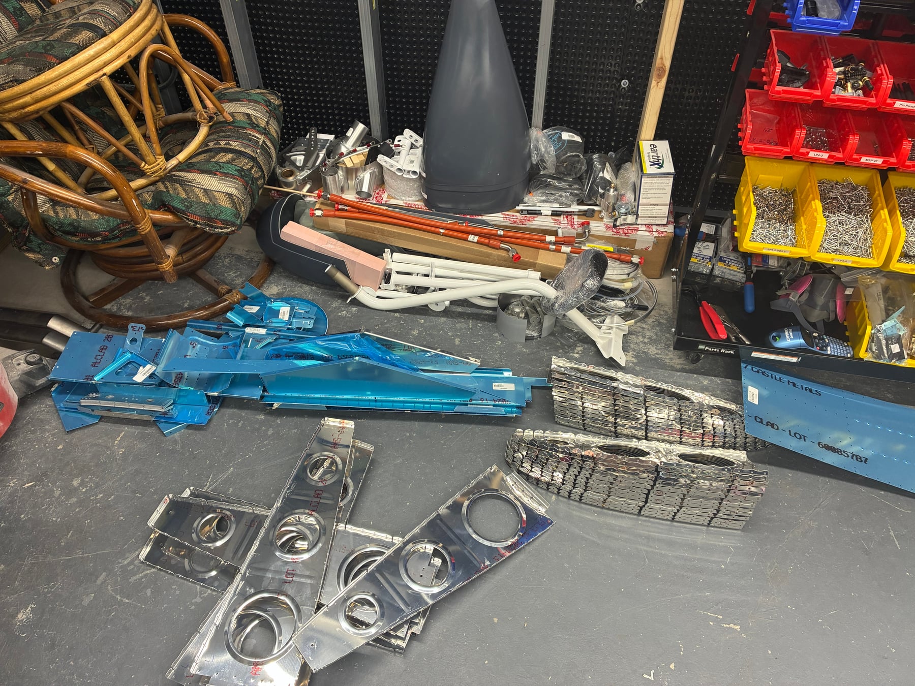 The wing ribs and all of the other pieces on the floor of the workshop.
